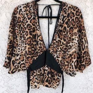 bebe leopard print top with a very deep V neckline
